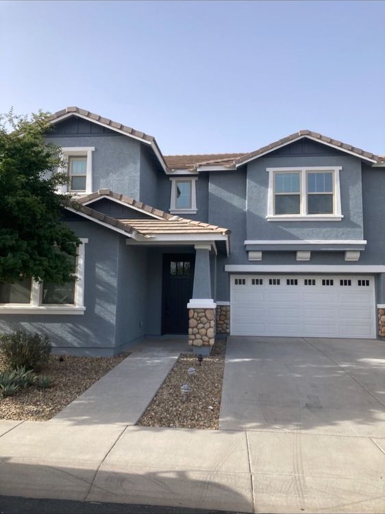 Blue-gray two-story home exterior painted by Nieman Painting in Mesa