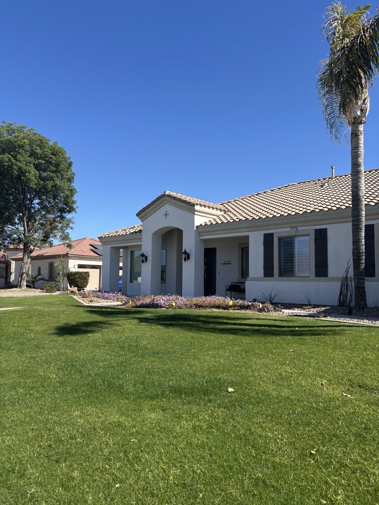 Freshly painted white ranch home exterior by Nieman Painting in Mesa, AZ
